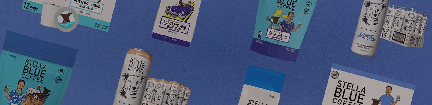 Multiple Stella Blue Coffee cans and boxes are arranged on a blue background, with some cans floating and others standing upright. The packaging is mostly blue, white, and black, with small colorful illustrations.