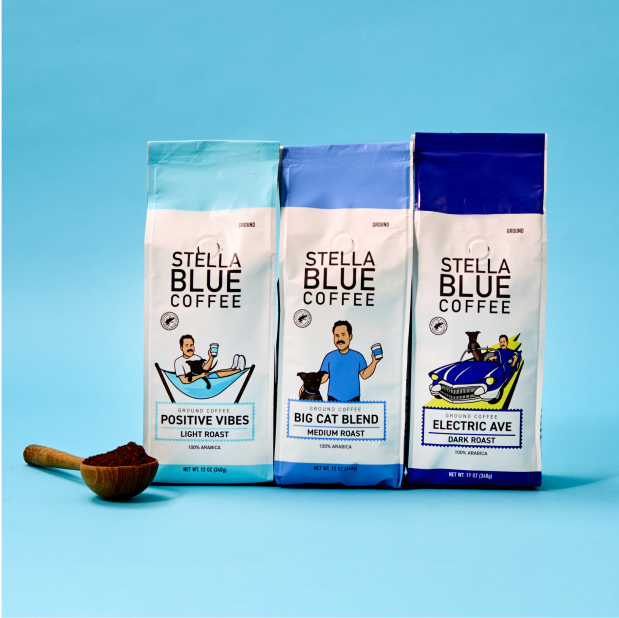 Three bags of stella blue ground coffee with a measuring spoon