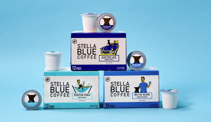 a stack of stella blue coffee pods and their boxes